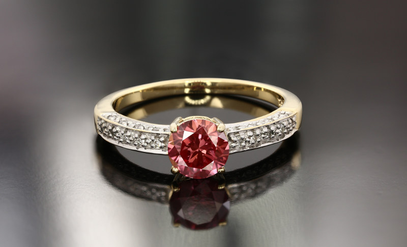 Gold ring with red diamond